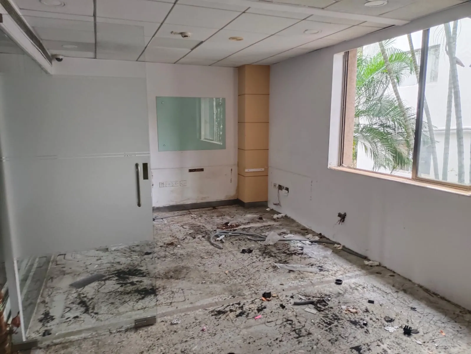 Sequential before and after comparison of an office dismantling service in Koramangala showcasing a corporate floor returned to bare shell status.